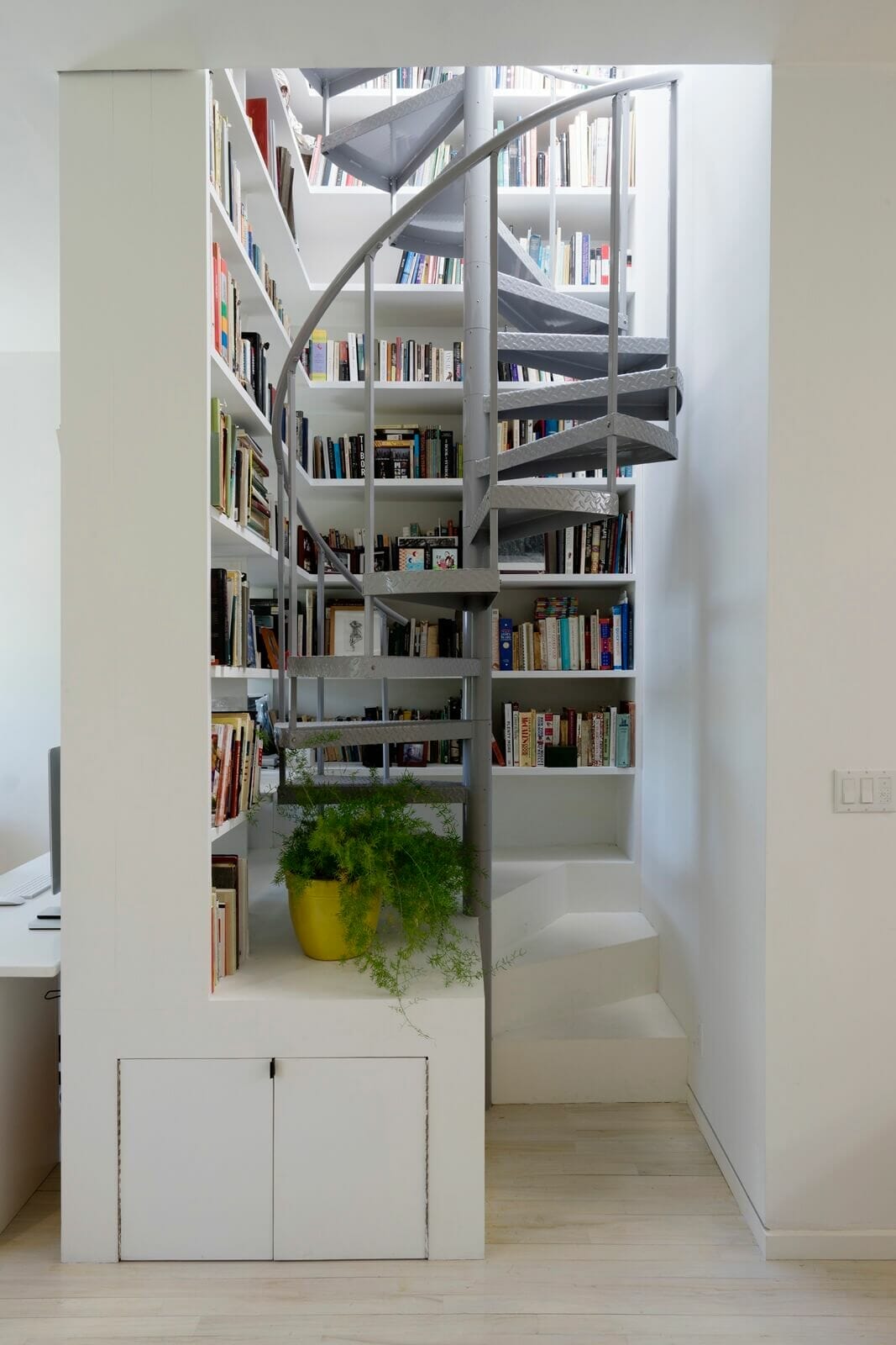 brownstoner-interior-design-ideas-brooklyn-league-studio-park-slope-04 aluminum interior staircase surrounded by bookshelves
